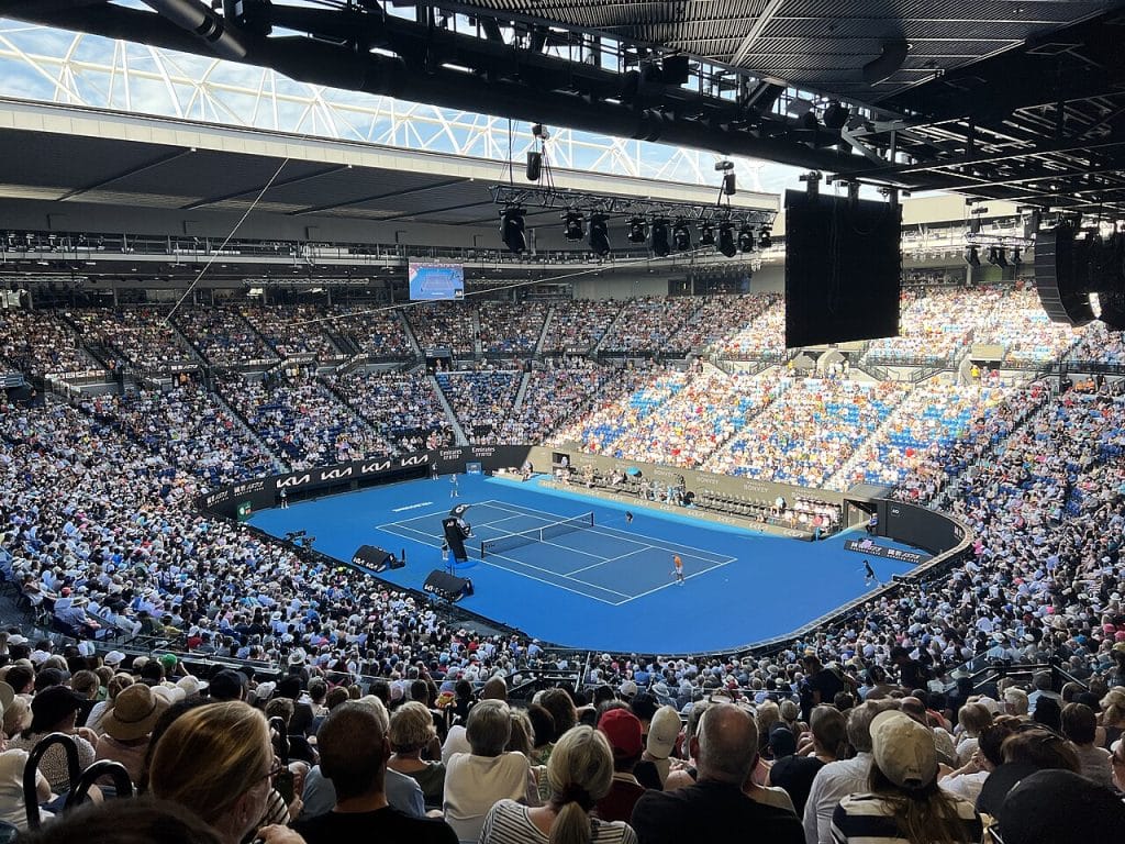 Spectators enjoying tennis match at Rod Laver Arena Australian Open, Melbourne advertising agency.